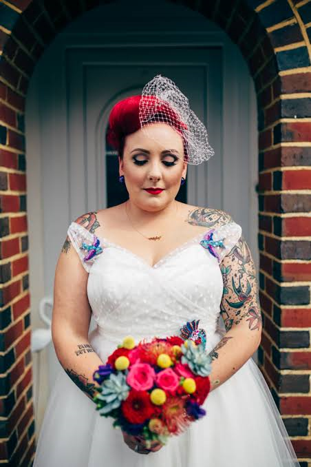 Blueberry Moon Cakes, a photo of a radiant bride with her bouquet. www.blueberrymooncakes.co.uk. Bristol, UK
